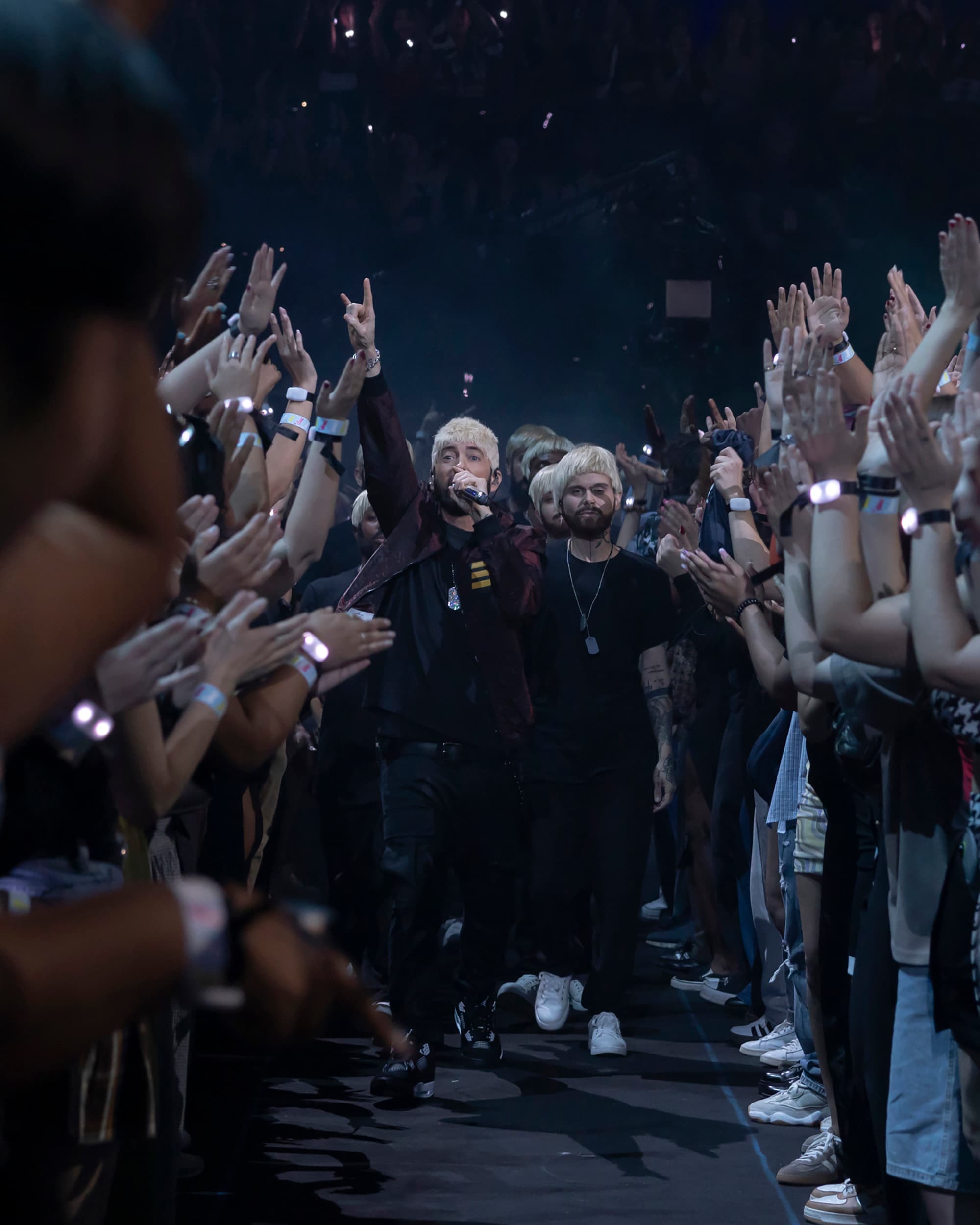Eminem walking through a tunnel of fans at the MTV VMAs